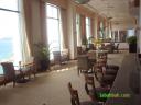 Floor to ceiling windows brings the South China Sea into the Pacific Club Lounge
